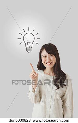 Japanese woman with light bulb View Large Photo Image Stock Photo - Japanese woman with light bulb. Fotosearch