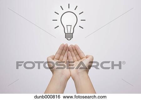 Stock Photograph - Japanese woman with light bulb. Fotosearch