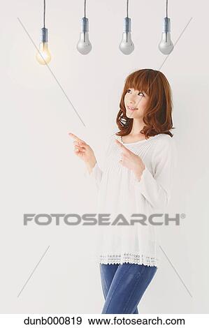 Japanese woman with light bulbs View Large Photo Image Stock Photo - Japanese woman with light bulbs. Fotosearch