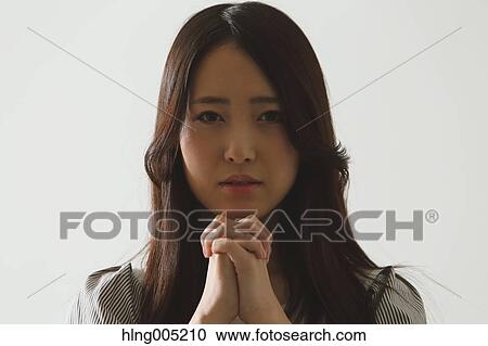 Japanese young woman praying View Large Photo Image Stock Image - Japanese young woman praying. Fotosearch
