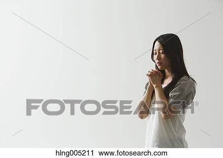 Japanese young woman praying View Large Photo Image Stock Image - Japanese young woman praying. Fotosearch