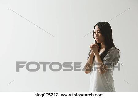 Japanese young woman praying View Large Photo Image Stock Image - Japanese young woman praying. Fotosearch