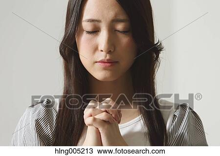 Japanese young woman praying View Large Photo Image Stock Image - Japanese young woman praying. Fotosearch