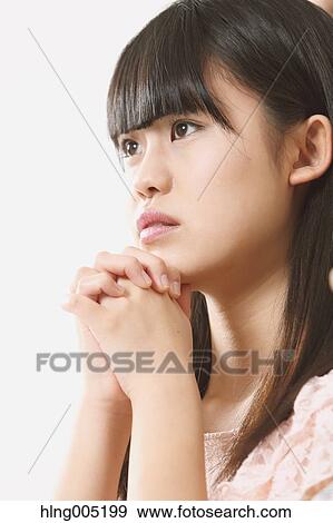 Japanese young woman praying View Large Photo Image Stock Photo - Japanese young woman praying. Fotosearch
