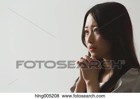 Japanese young woman praying View Large Photo Image Stock Photo - Japanese young woman praying. Fotosearch