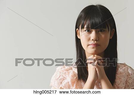 Japanese young woman praying View Large Photo Image Stock Photo - Japanese young woman praying. Fotosearch