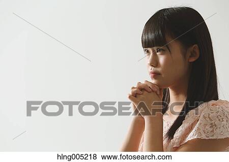 Japanese young woman praying View Large Photo Image Stock Photo - Japanese young woman praying. Fotosearch