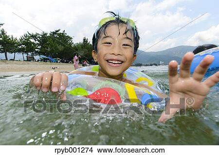 Kid at the beach View Large Photo Image Picture - Kid at the beach. Fotosearch