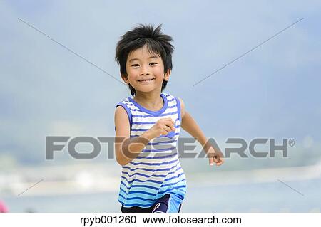 Kid at the beach View Large Photo Image Stock Image - Kid at the beach. Fotosearch