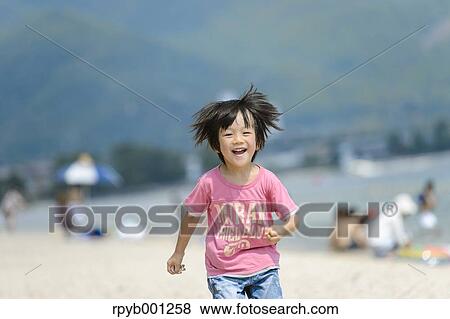 Kid at the beach View Large Photo Image Stock Photo - Kid at the beach. Fotosearch