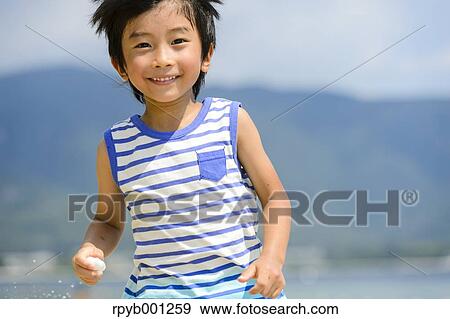 Kid at the beach View Large Photo Image Stock Photo - Kid at the beach. Fotosearch