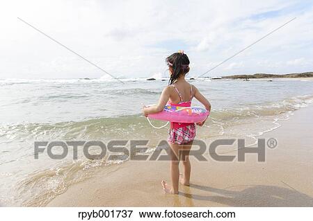 Kid at the beach View Large Photo Image Stock Photo - Kid at the beach. Fotosearch