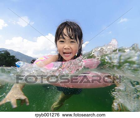 Kid at the beach View Large Photo Image Stock Photograph - Kid at the beach. Fotosearch