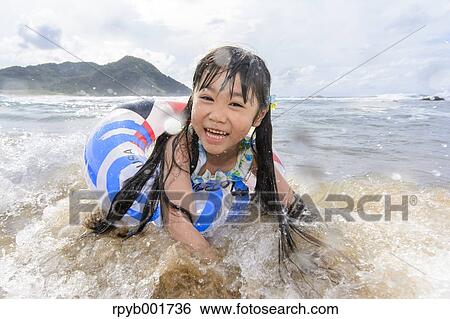 Kid at the beach View Large Photo Image Stock Photograph - Kid at the beach. Fotosearch