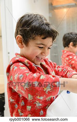 Kid brushing teeth in a pijama View Large Photo Image Stock Photograph - Kid brushing teeth in a pijama. Fotosearch