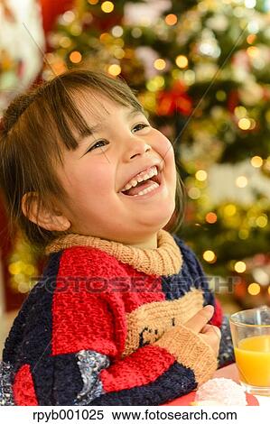 Kid eating in the house at Christmas View Large Photo Image Stock Photography - Kid eating in the house at Christmas. Fotosearch