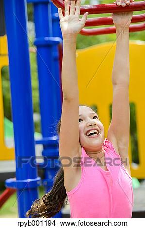 Picture - Kid playing in a city park. Fotosearch