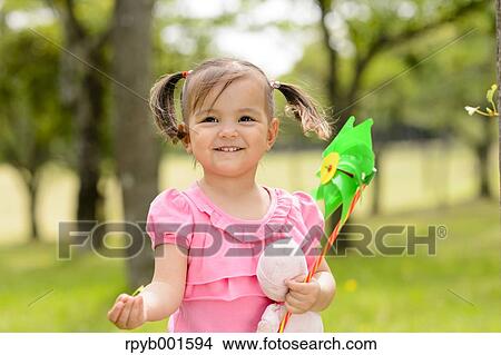 Kid playing in a city park View Large Photo Image Picture - Kid playing in a city park. Fotosearch