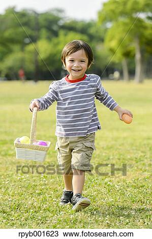 Kid playing in a city park View Large Photo Image Stock Image - Kid playing in a city park. Fotosearch