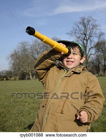 Kid playing in a city park View Large Photo Image Stock Photo - Kid playing in a city park. Fotosearch