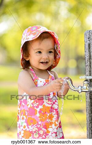 Kid playing in a city park View Large Photo Image Stock Photo - Kid playing in a city park. Fotosearch