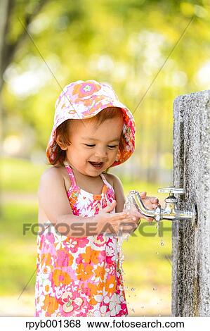 Kid playing in a city park View Large Photo Image Stock Photo - Kid playing in a city park. Fotosearch