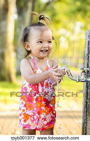 Kid playing in a city park View Large Photo Image Stock Photo - Kid playing in a city park. Fotosearch