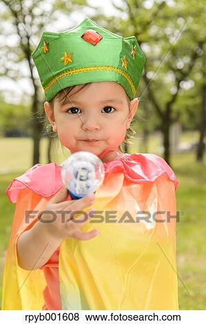 Stock Photo - Kid playing in a city park. Fotosearch