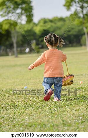Kid playing in a city park View Large Photo Image Stock Photo - Kid playing in a city park. Fotosearch