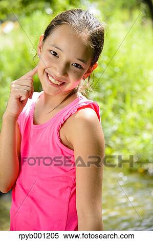 Stock Photography - Kid playing in a city park. Fotosearch