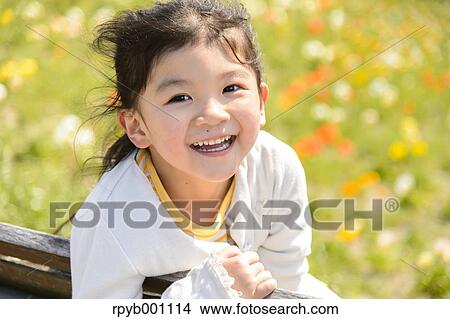 Kid playing in a park View Large Photo Image Picture - Kid playing in a park. Fotosearch