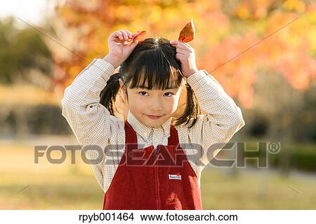 Kid playing in a park View Large Photo Image Picture - Kid playing in a park. Fotosearch