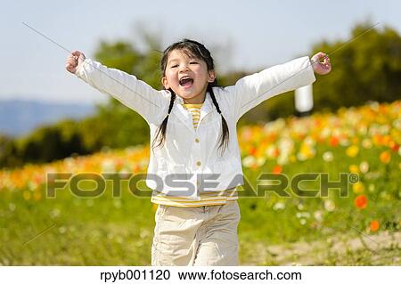 Kid playing in a park View Large Photo Image Stock Image - Kid playing in a park. Fotosearch
