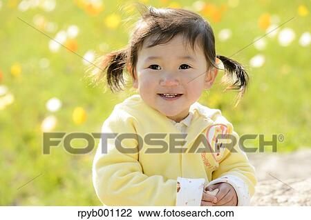 Kid playing in a park View Large Photo Image Stock Image - Kid playing in a park. Fotosearch