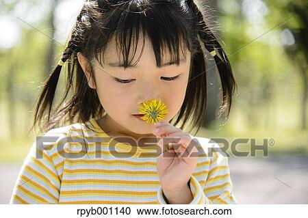 Kid playing in a park View Large Photo Image Stock Image - Kid playing in a park. Fotosearch