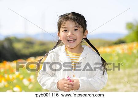 Kid playing in a park View Large Photo Image Stock Photograph - Kid playing in a park. Fotosearch