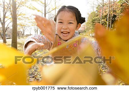 Kid playing in a park View Large Photo Image Stock Photography - Kid playing in a park. Fotosearch