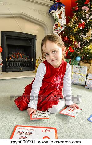 Kid playing in the house at Christmas View Large Photo Image Stock Image - Kid playing in the house at Christmas. Fotosearch
