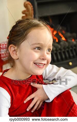 Stock Image - Kid playing in the house at Christmas. Fotosearch