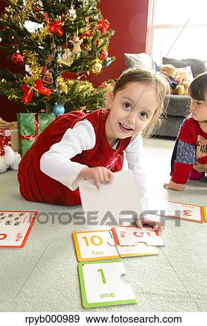 Kid playing in the house at Christmas View Large Photo Image Stock Photo - Kid playing in the house at Christmas. Fotosearch