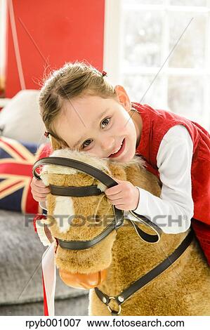 Stock Photo - Kid playing in the house at Christmas. Fotosearch