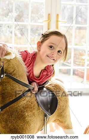 Stock Photo - Kid playing in the house at Christmas. Fotosearch