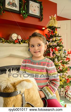 Kid playing in the house at Christmas View Large Photo Image Stock Photo - Kid playing in the house at Christmas. Fotosearch