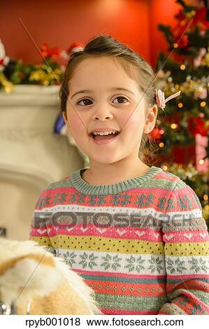 Kid playing in the house at Christmas View Large Photo Image Stock Photo - Kid playing in the house at Christmas. Fotosearch