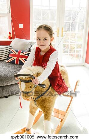 Stock Photography - Kid playing in the house at Christmas. Fotosearch