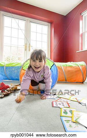 Picture - Kid playing in the house. Fotosearch