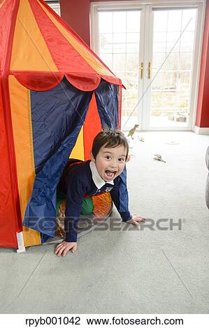 Kid playing in the house View Large Photo Image Stock Image - Kid playing in the house. Fotosearch