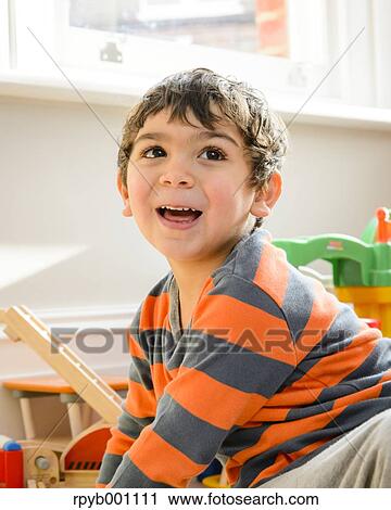 Kid playing in the house View Large Photo Image Stock Image - Kid playing in the house. Fotosearch
