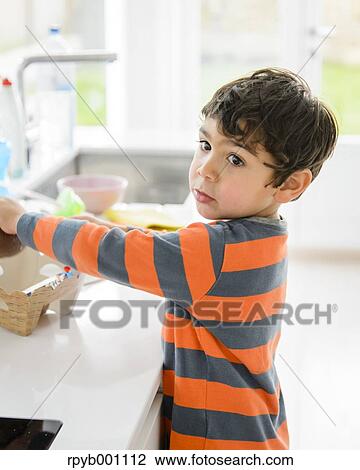 Stock Image - Kid playing in the house. Fotosearch