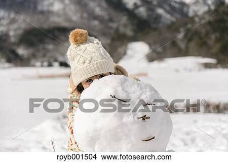 Kid playing in the snow View Large Photo Image Picture - Kid playing in the snow. Fotosearch